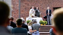 Couples attend a blessing outside a Catholic church in Cologne