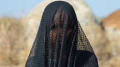 Ethiopia woman cover her face wit veil sake of dust