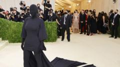 Kim Kardashian dressed in an all-enveloping black outfit that also covers her face