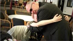 Pastor Mick comforts John