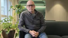 Phil Jones, a leaseholder sitting in his flat in Westcliff-on-Sea