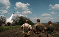 Ukrainian militaries supervise as a M142 HIMARS launching a rocket on the Bakhmut direction