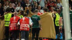 Hungary's Varga stable after going off on stretcher