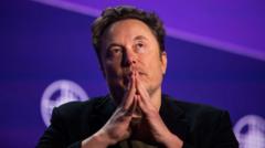 WhatsApp boss in online spat with Elon Musk
