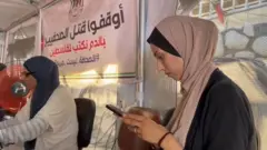 Two women -jourgists who work in the tent