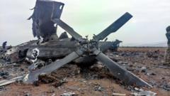 The wreckage of the military helicopter that US forces destroyed following the raid