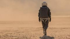 An artist impression of an astronaut walks on Mars surface
