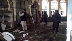 People survey damage to mosque