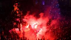 French supporters light flares as they celebrate their team's victory over England in the Qatar 2022 World Cup quarter-final football match in Montpellier on December 10, 2022