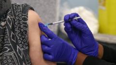 Woman receiving a fourth Covid vaccine dose this spring