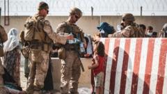 U.S. Marines hand out water during an evacuation at Kabul's airport