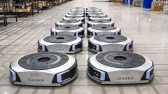 Geek+ floor robots lines up in a UK warehouse