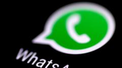 WhatsApp logo in close-up from a phone screen