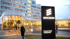 A woman walks past the Ericsson headquarters in Stockholm, Sweden, on January 24, 2020