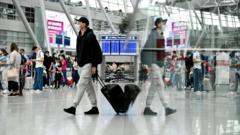 Travellers in the departure area of the international airport in Dusseldorf