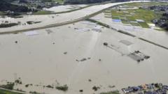 An aerial view shows submerged houses at a flooded area caused by heavy rains due to Typhoon Nanmadol in Kunitomi, Miyazaki Prefecture on the island of Kyushu, Japan September 19, 2022.