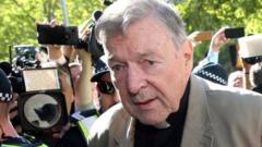 Image shows Cardinal George Pell arriving at court earlier this month