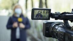 A female journalist in a protective medical mask is reporting in a deserted city. Concept of protection against dangerous coronavirus. TV report on the epidemic.