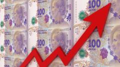 Pesos argentinos con un gráfico que muestra un alza