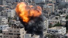 Flames and dark smoke rise from an Israeli air strike in Gaza City