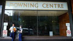Police officers talk in front of the Downing Centre local courts on February 19, 2015 in Sydney, Australia.