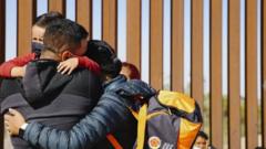 Family embraces at border