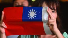 A woman holds a Taiwanese flag