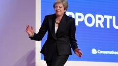 Theresa May dancing on stage at the 2018 Conservative party conference