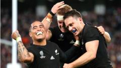 Ben Smith (R) of New Zealand celebrates with Sam Cane and Aaron Smith