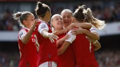 Arsenal WSL team celebrating after their win
