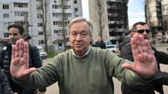 UN Secretary-General Antonio Guterres gestures as he attends a visit in Borodianka, outside Kyiv, on 28 April 2022
