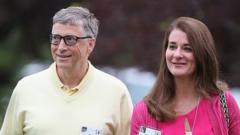 Bill and Melinda Gates walking through garden area at 2015 event