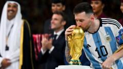 Lionel Messi kisses trophy