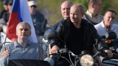 Russian President Vladimir Putin rides a bike in Sevastopol, Crimea on 10 August 2019