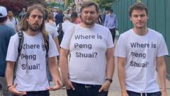 Campaigners wearing T-shirts with the question "Where is Peng Shuai?"