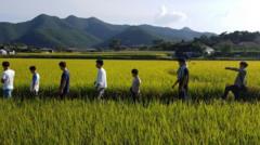 Kim's foster family in a field, South Korea