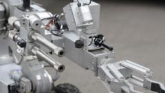 A bomb disposal robot extends its arm