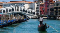 A gondola sailing on the Grand Canal in Venice in 2020