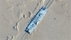 A satellite image shows a mock-up US military ship in the desert in Xinjiang, north-western China