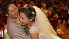A couple hug during feast at a Chinese wedding ceremony