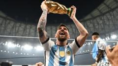 Messi celebrates with the World Cup trophy