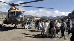Injured people being carried to a helicopter