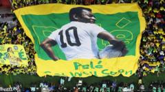 Brazil fans hold a banner showing support for Pele during the Fifa World Cup in Qatar