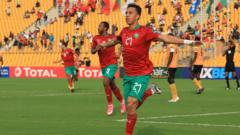 Morocco's Soufiane Rahimi celebrates opening the scoring in Douala