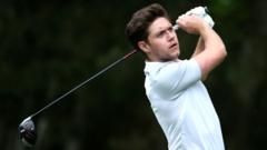 Niall Horan playing golf