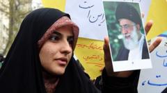 Iranian woman holds portrait of Iran's Supreme Leader Ayatollah Khamanei (file photo)