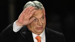 Hungarian Prime Minister Viktor Orban celebrates on stage at the election base, 'Balna' building on the bank of the Danube River of Budapest, on 3 April 2022