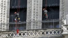 Workers are seen restoring the Notre-Dame cathedral
