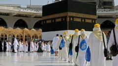Pilgrims arrive at the Kaaba, Islam's holiest shrine, at the Grand mosque in the holy city of Meccca