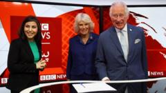 Prince Charles and Camilla, Duchess of Cornwall are pictured with Sana Safi BBC Afghan Senior Presenter while visiting a TV studio at BBC Broadcasting house in London